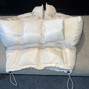 Cream After 5 crop puffer coat has adjustable waist.